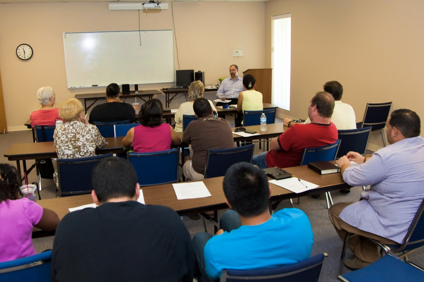 Students listening and taking part in a classroom discussion.