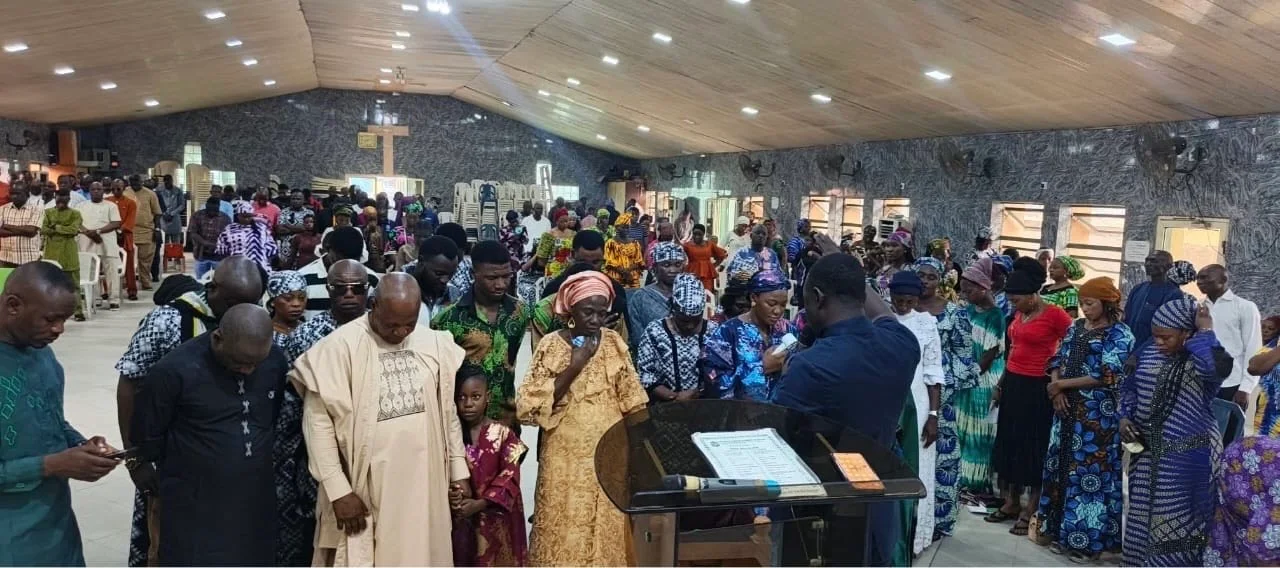 The Lagos congregation gathered in prayer before its church building was demolished